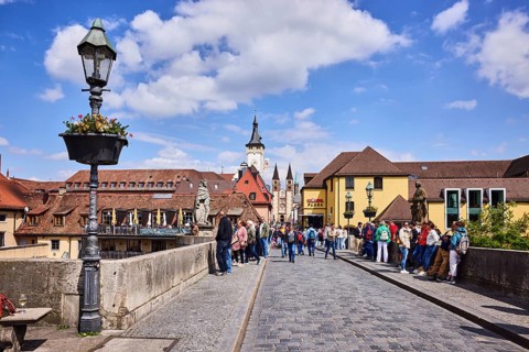 Old Main bridge, footbridge, concrete wall, lantern, suspended flower pot, houses, bridge saint,