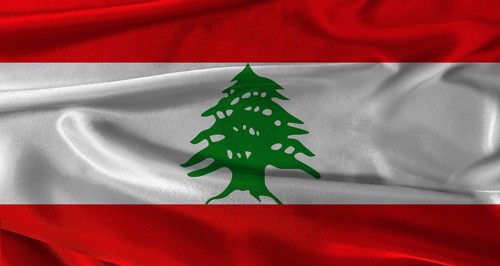 Flag of Lebanon with fabric textured background. Close up of National flag of Lebanon with