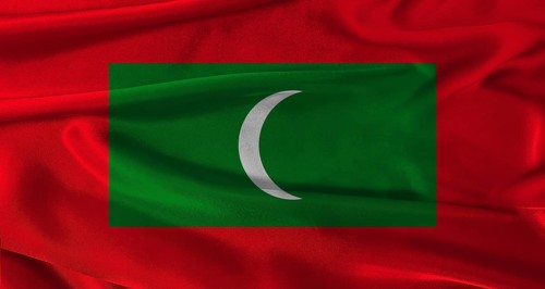 Flag of Maldives with fabric textured background. Close up of National flag of Maldives with