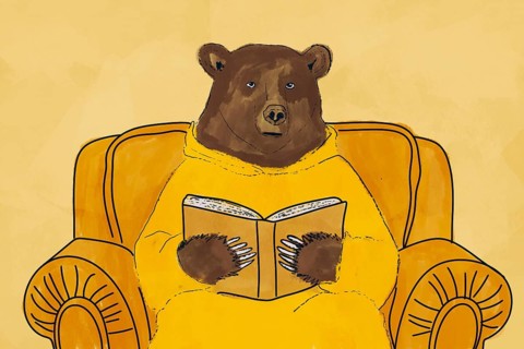 A charming illustration of a bear engrossed in a book while seated in a comfortable yellow armchair