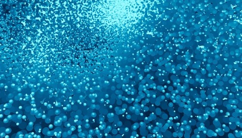 A large collection of vibrant blue spheres in various sizes, rendered in 3D to create a visually