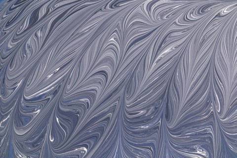 A captivating abstract design in grey and white, featuring elegant swirling patterns. This fluid