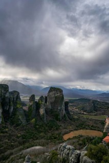 Panoramic view of Meteora's towering rock formations and ancient monasteries in Kalabaka, Greece,