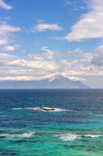 Captivating view of the Aegean Sea with vibrant blue and turquoise waters in Greece. Mount Athos