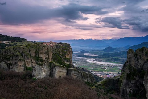 Captivating sunset view of the historic Holy Trinity Monastery perched atop towering cliffs in