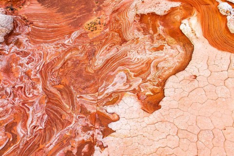 This image captures the stunning and intricate patterns of red and white rock formations,
