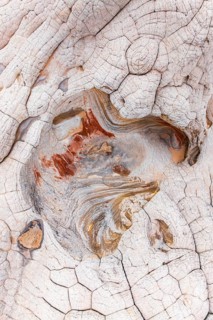 Close-up image showcasing the stunning, abstract patterns of eroded red and white rocks,