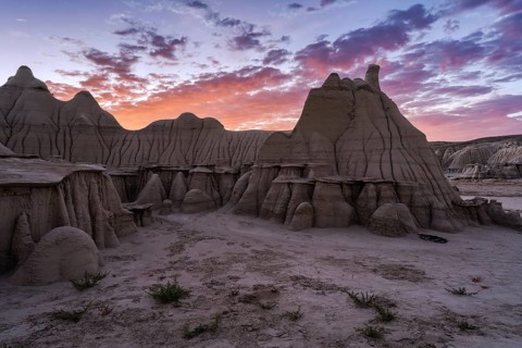 Stunning sunset illuminating the unique rock formations in the Bisti/De-Na-Zin Wilderness in New