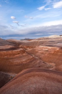 Panoramic view of Hanksville's bentonite hills in Utah, showcasing layers of vibrant earth tones