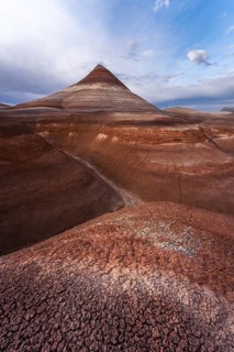 A stunning view of Hanksville Bentonites in Utah showcases layered, multicolored formations under a