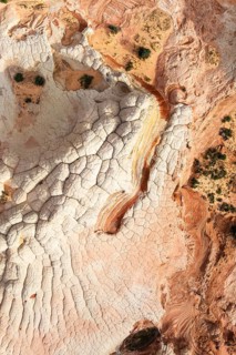 Aerial view capturing a desert landscape with rock formations, showcasing natural textures and