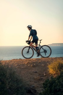 A young man enjoying a bike ride along the scenic coastal trails of Zahara de los Atunes in Cadiz