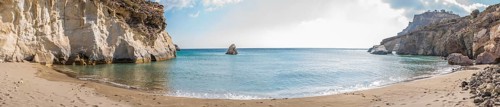Panoramic image of the secluded beach Gerontas on the Island of Milos in Greece, showcasing