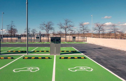 A newly constructed electric vehicle charging station in Valdebebas, Madrid, showcasing green