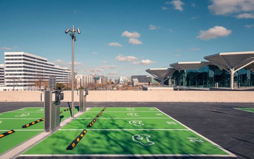 A newly constructed transport hub in Valdebebas, Madrid, featuring a sleek glass facade and modern