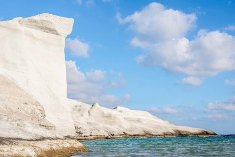 Breathtaking view of unique white rock formations against a clear blue sky at Sarakiniko on the