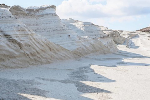 Striking, natural white rock formations at Sarakiniko Beach on the island of Milos, Greece. The