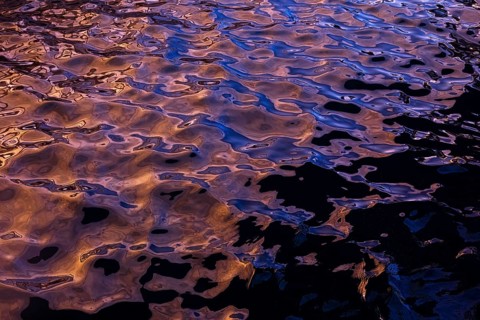 Rippling water creates abstract shapes and textures in this photograph from La Pared, Fuerteventura