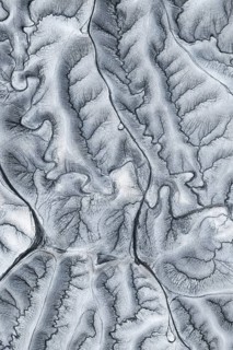 Captivating aerial shot of the unique, undulating terrain at Moonscape Overlook in Utah, showcasing