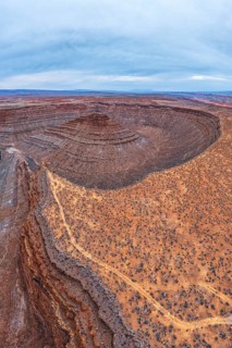 A breathtaking aerial view captures the intricate layers of a desert in San Juan canyon, showcasing