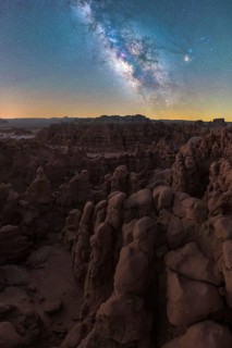 Captivating night sky illuminates the unique rock formations of Goblin Valley State Park in Utah,