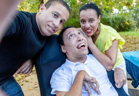 Spanish Cameroonian siblings enjoying a moment outdoors. The family shares a joyful connection,
