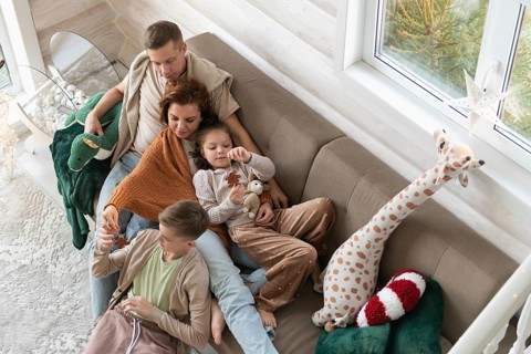 Top view of a festive setting with a winter view and holiday deco. A joyful family celebrates