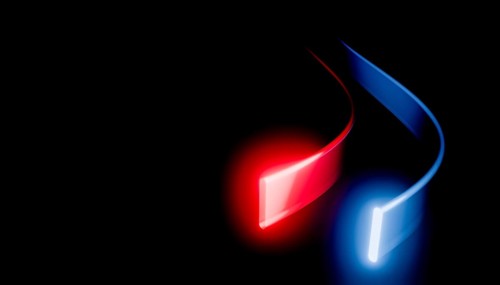 A visually striking 3D render featuring abstract, glowing neon lines in red and blue curving