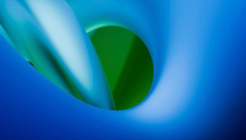 A visually soothing image with smooth blue tones transitioning into a sharp green oval shape set