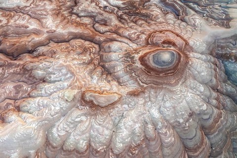 This aerial image captures the mesmerizing abstract patterns of bentonite sandstone in Utah, USA.