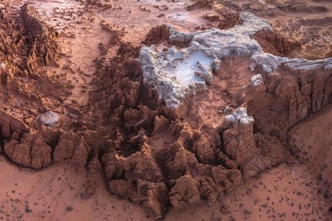 Aerial view of the unique, eroded rock formations in Goblin Valley State Park, Utah, showcasing the