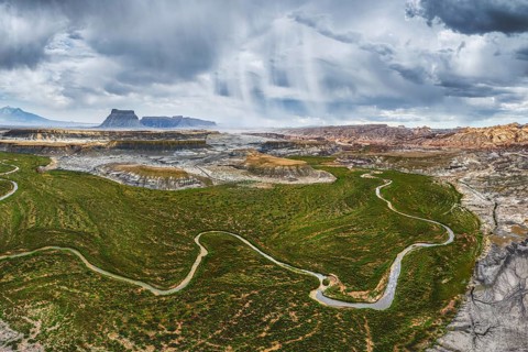 Overhead drone shot capturing the expansive and rugged terrain of Hanksville, Utah, featuring