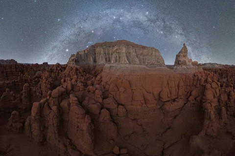 Majestic night sky filled with stars and the Milky Way above the unique sandstone formations of