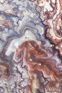 Stunning aerial view of Utah's bentonite sandstone formations. The vibrant layers create a