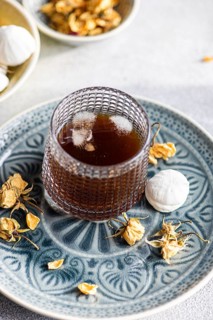 A delectable homemade vanilla mini zephyr-marshmallow filled with rose jam, paired with a