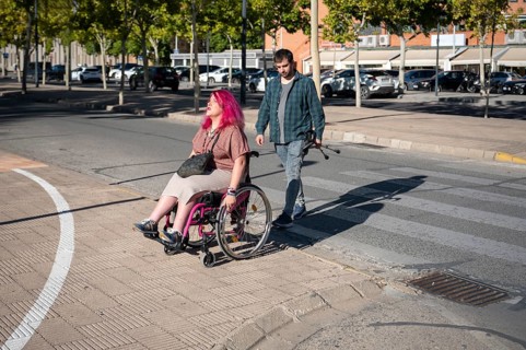 A couple navigates college life, highlighting inclusivity and diversity The woman, using a