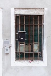 Mailboxes behind a latticed window, Venice, Veneto, Italy