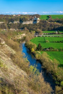 View of the river Saale, the village of Saaleck and the ruins of Rudelsburg and Saaleck castles,