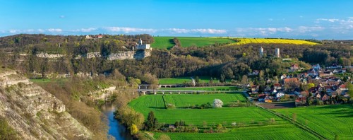 View of the river Saale, the village of Saaleck and the ruins of Rudelsburg and Saaleck castles,