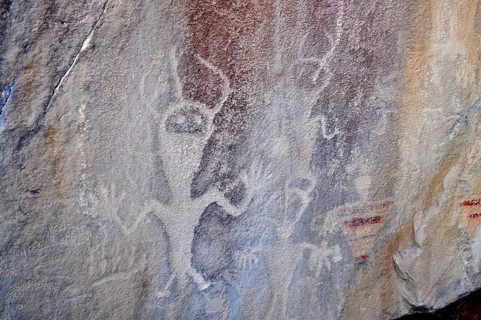 Prehistoric rock carvings, petroglyphs from the Fremont culture, of human-like figures on a rock,