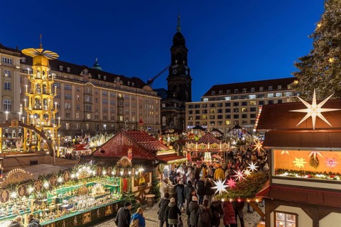 Large pyramid at the Striezelmarkt Christmas market on the Altmarkt in Dresden, in the background