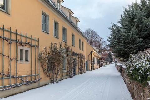 Historic wine houses with trellises on the snowy vineyard road in Oberlössnitz, Radebeul, Saxony,
