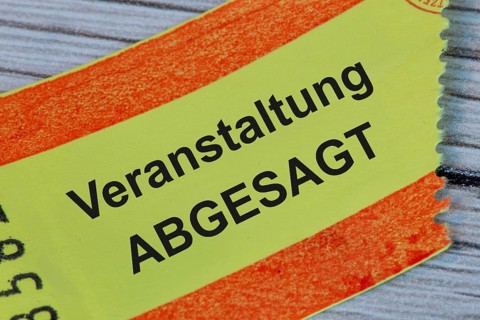 (photo montage) Ticket with text EVENT CANCELLED
