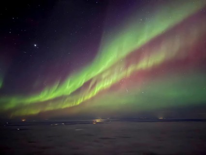 Northern lights, aurora borealis, aerial view from an airplane, Finland