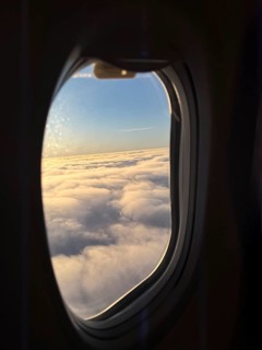 View of a sea of clouds from an airplane window, Finland