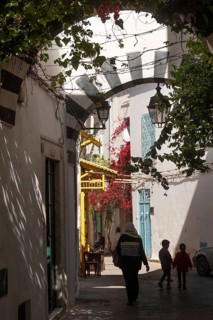 Tunis, Tunisia. 4th May 2024 A Tunisian mother and her children walk in the beautiful narrow