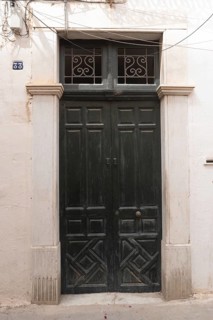 Green door of the childhood home of Ibn Khaldun, Arab Muslim sociologist and philosopher born in