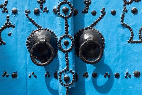 Detail of beautiful blue ornate door in the narrow streets of Tunis Medina, the historical Kasbah