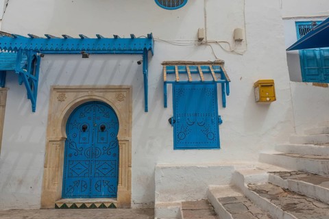 Authentic blue coloured architecture of the Tunisian cliff top village of Sidi Bou Said,