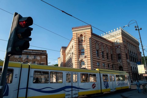 Sarajevo, Bosnia and Herzegovina. July 24th 2019 A tram passing Sarajevo City Hall, known as